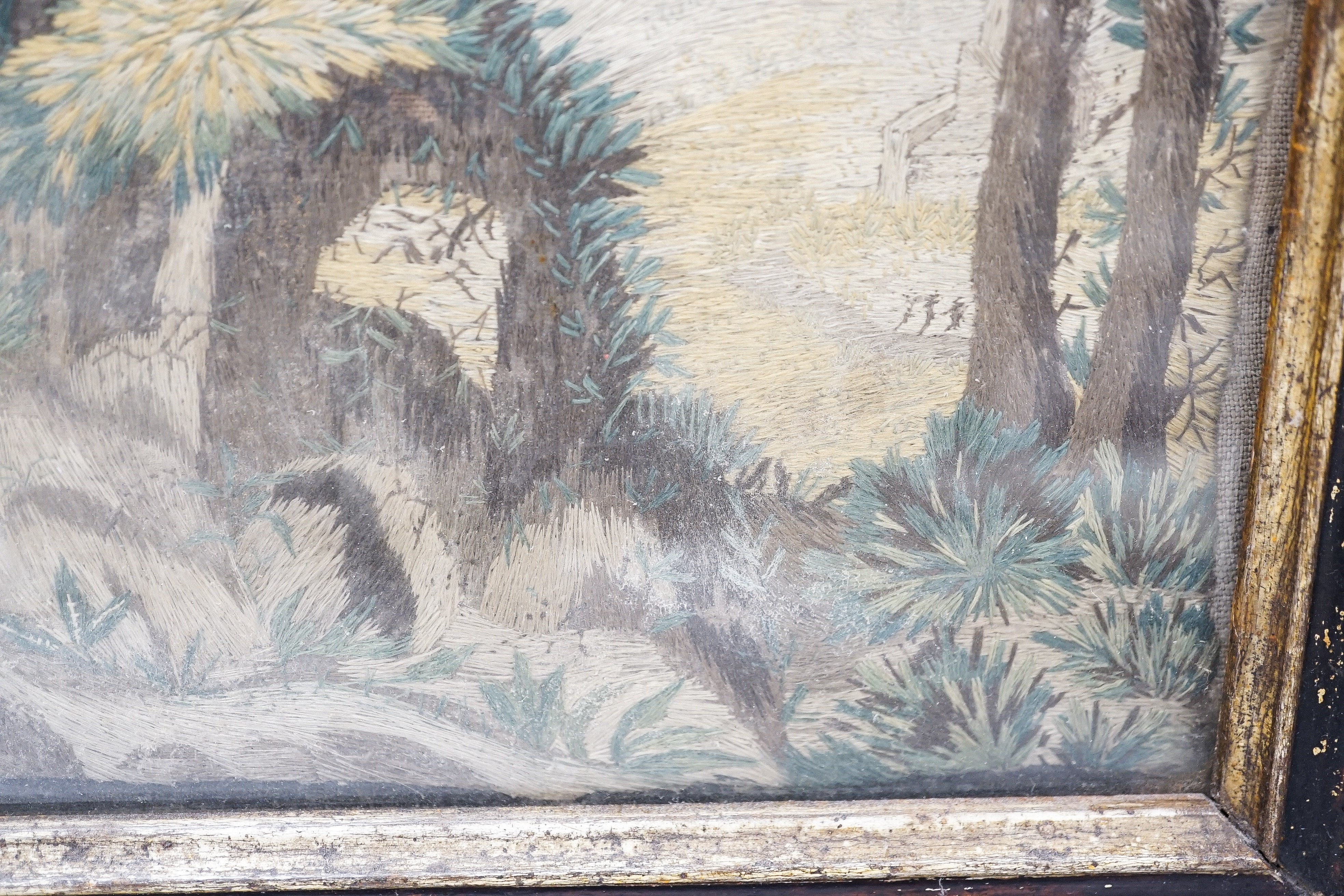 A pair of 18th century wool and silkwork pictures in ebonised frames, 26 cms high x 22 cms wide.